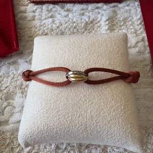 Cartier trinity cord bracelet with extra silk cords
